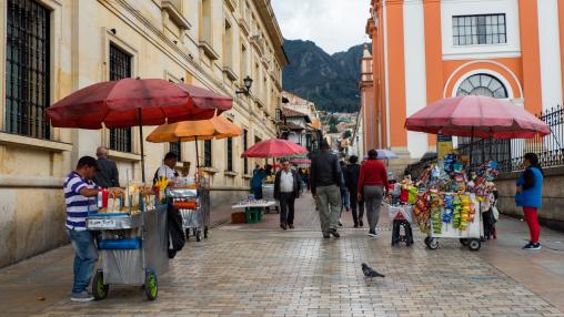 People and their small businesses on the street, Colombian fast food, Bogotá, La Candelaria district. 