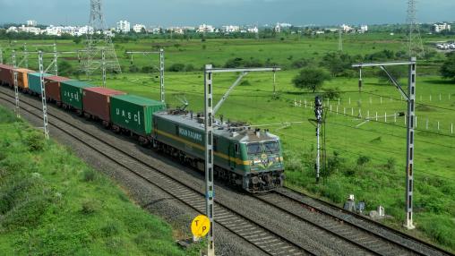 Freight train hauled by a WAG9 electric locomotive at Vadgaon near Pune India.