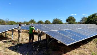 Tourists taking a tour of the solar panels at Asilia Jabali Ridge safari camp in Ruaha National Park, Tanzania