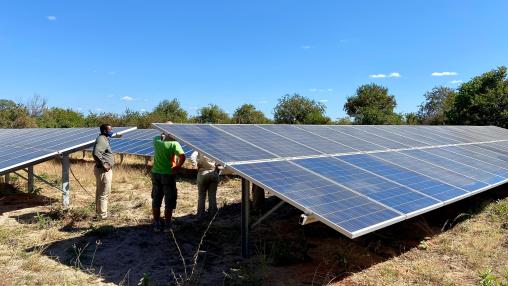 Tourists taking a tour of the solar panels at Asilia Jabali Ridge safari camp in Ruaha National Park, Tanzania