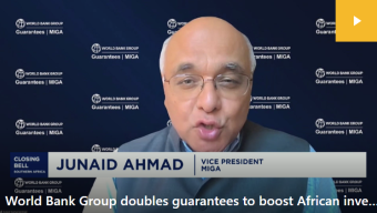 "Junaid Ahmad, MIGA Vice President, speaks during a CNBC Africa interview in front of a World Bank Group | MIGA branded background.